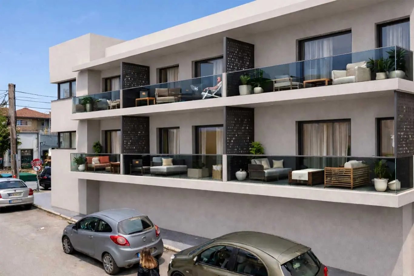 AVAIA Boutique Hotel Balcony View with spacious balconies, glass railings, and outdoor lounge seating.