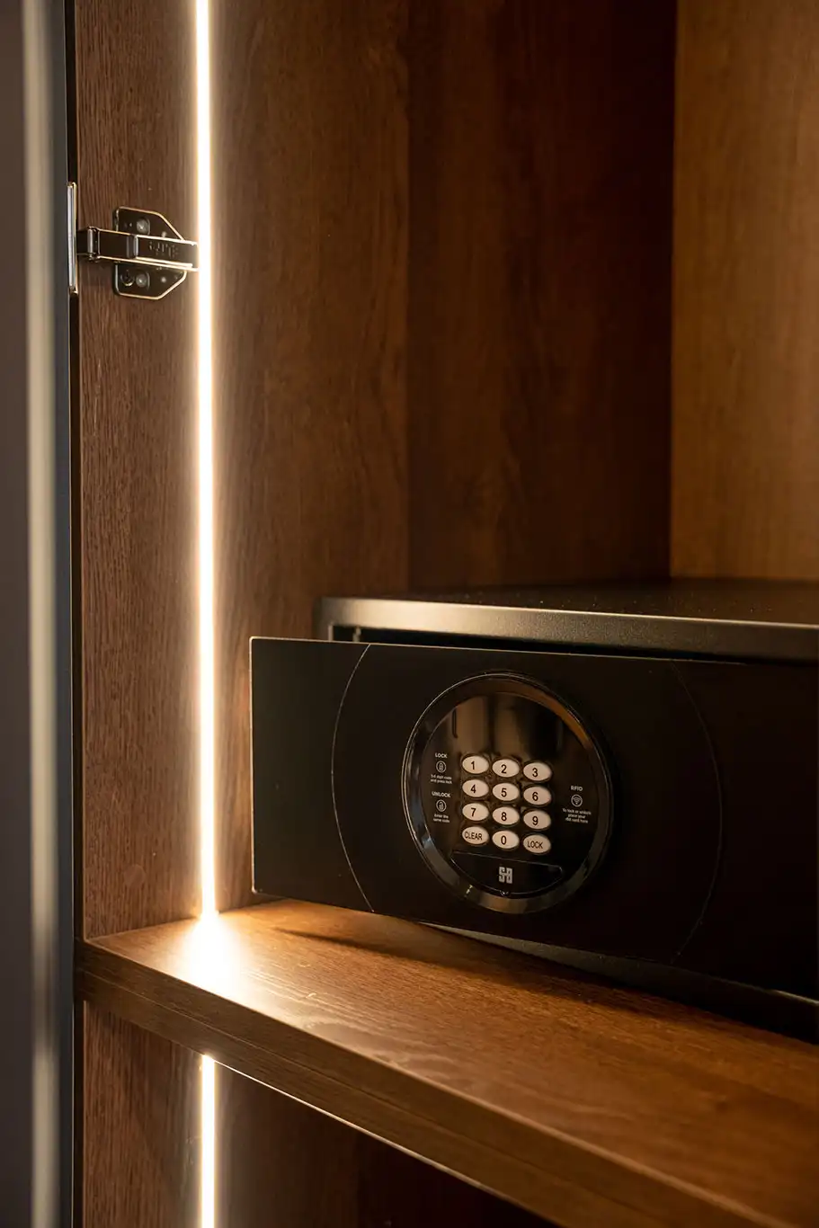 Electronic safe installed inside a wooden illuminated wardrobe in Superior Luxury Room 102