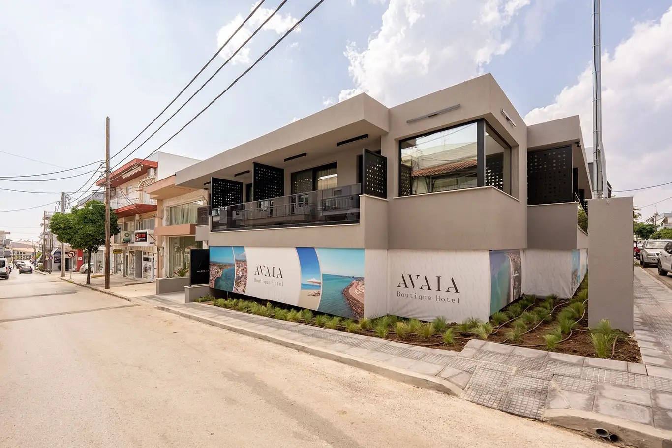 Corner daytime view of the modern Avaia Boutique Hotel building in Moudania