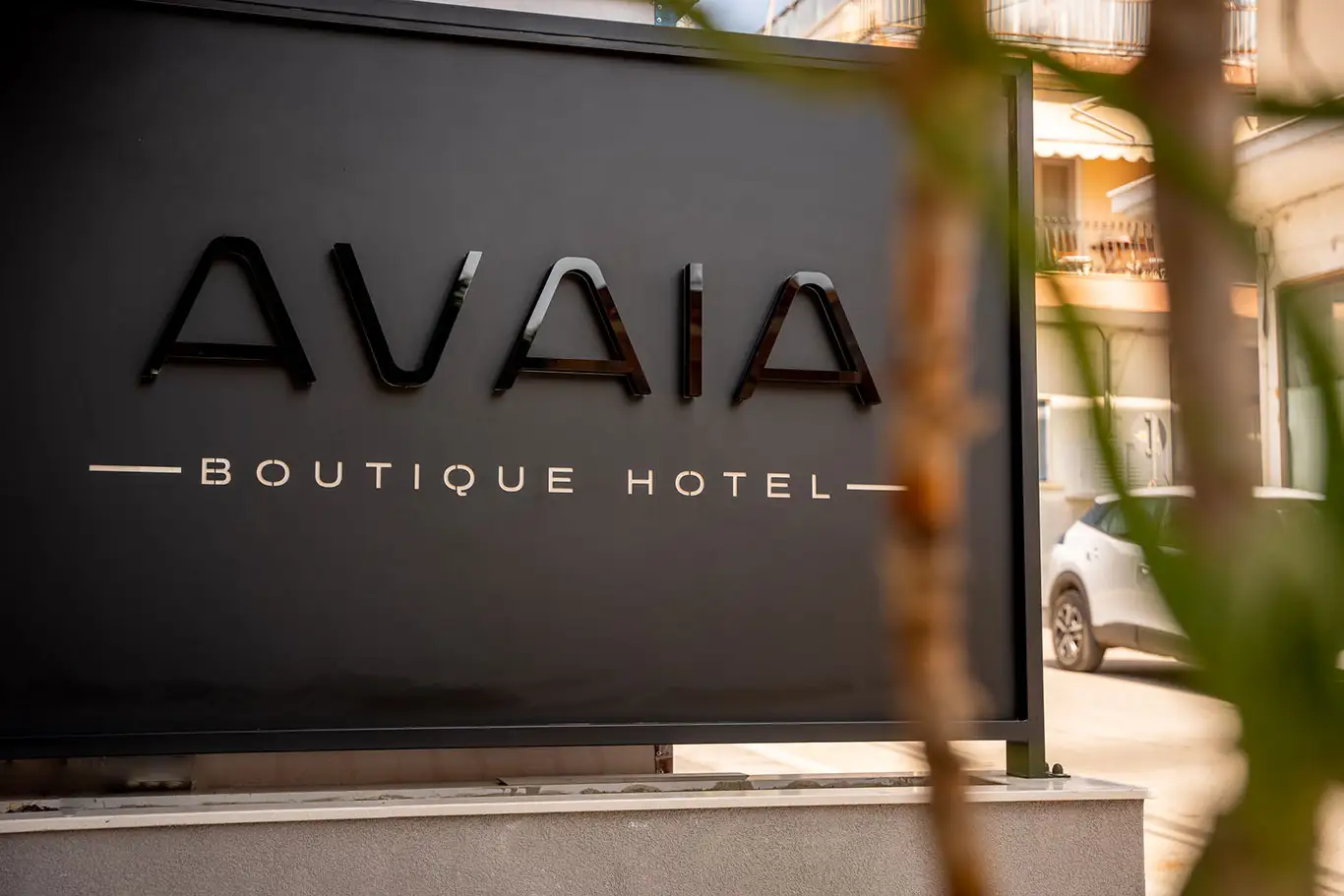 Close-up of the Avaia Boutique Hotel exterior logo and sign in Moudania