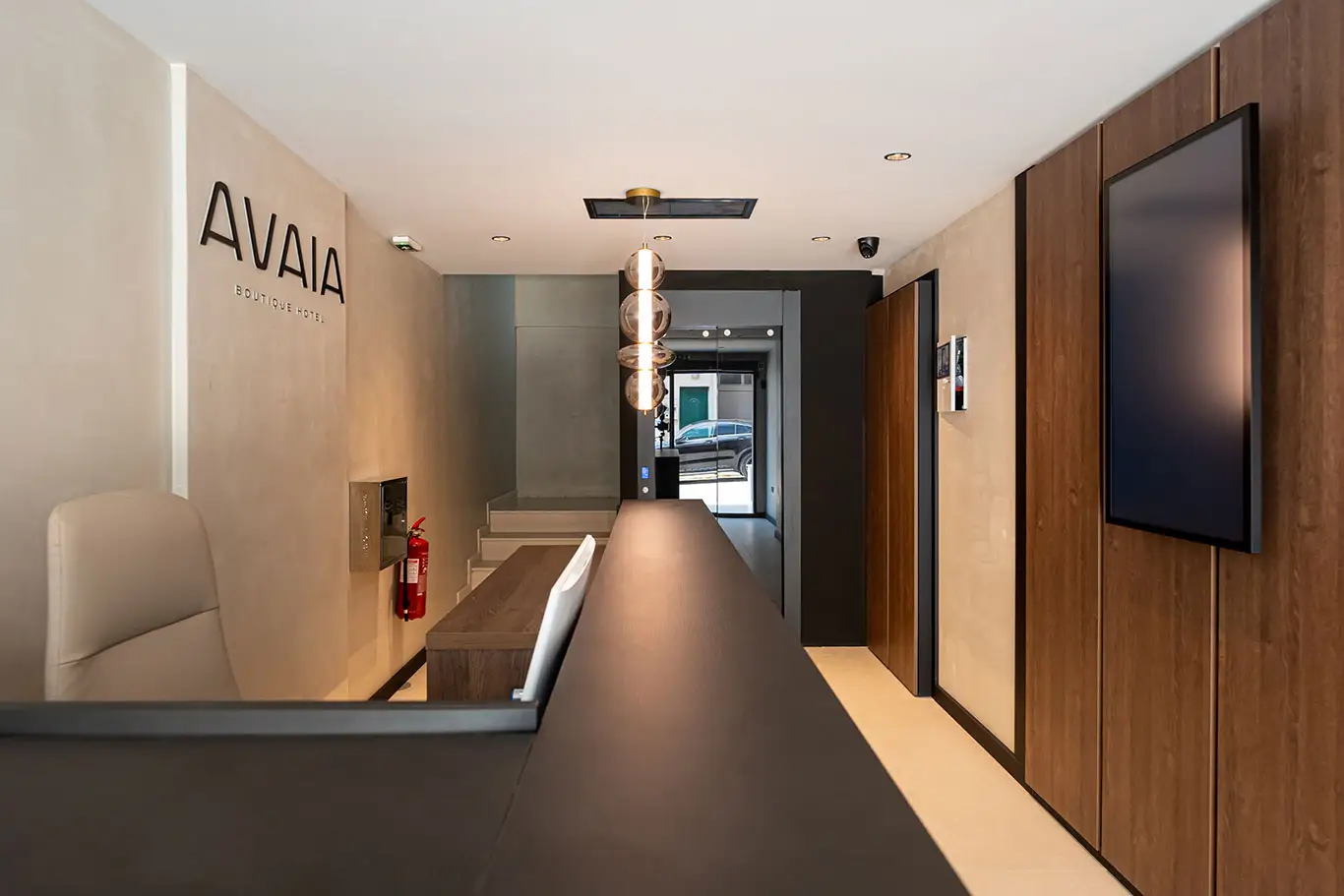 Modern reception desk and wood-panelled interior at Avaia Boutique Hotel in Moudania