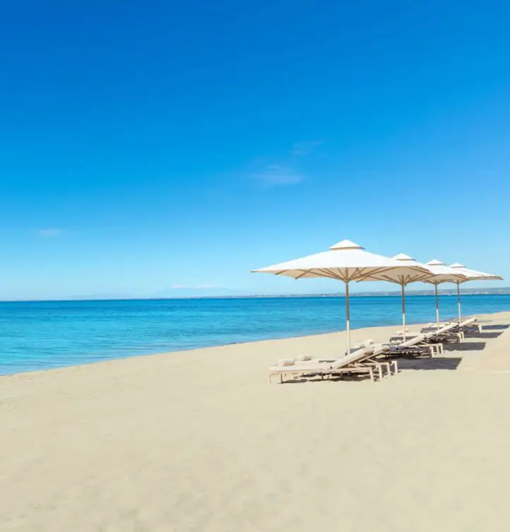Nea Moudania Beach with sunbeds and umbrellas by the sea